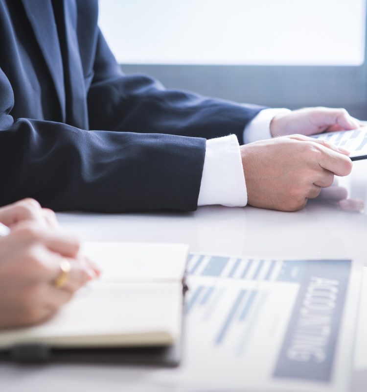 Business adviser analyzing financial figures denoting the progress in the work of the company