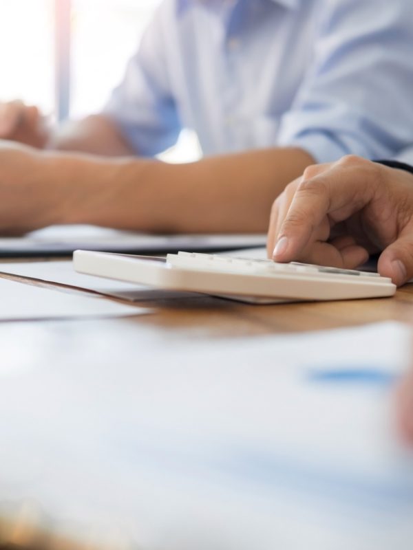 Administrator business man financial inspector and secretary making report, calculating balance. Internal Revenue Service checking document. Audit concept